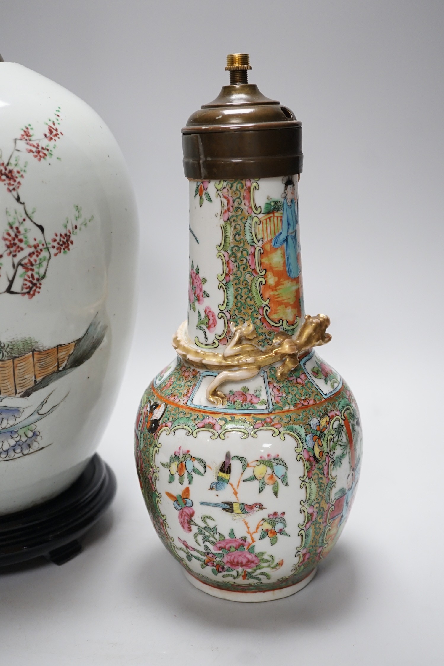 A Chinese famille rose vase converted to a lamp, 26cm, and a larger Chinese vase/lamp base, on stand, 41cm high